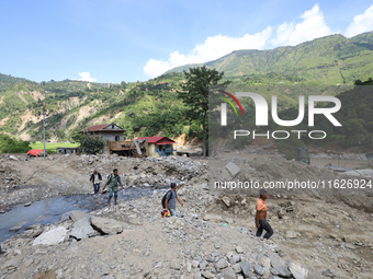 Nepali passengers travel through the BP Highway, a major highway that connects Kathmandu directly with the Southern Plains of Nepal, making...