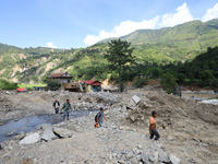 Nepali passengers travel through the BP Highway, a major highway that connects Kathmandu directly with the Southern Plains of Nepal, making...