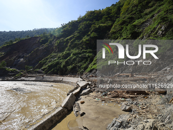 A section of BP Highway, a major highway that connects Kathmandu directly with the Southern Plains of Nepal, is damaged by a landslide in Ka...