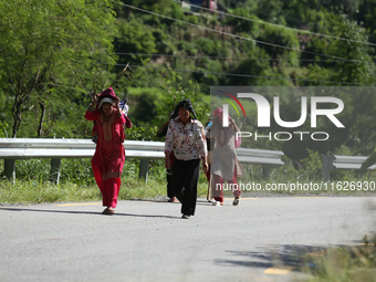 Nepali passengers travel through the BP Highway, a major highway that connects Kathmandu directly with the Southern Plains of Nepal, making...