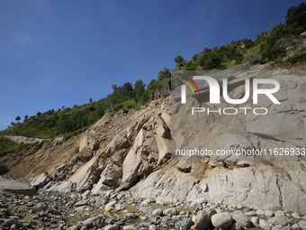 A section of BP Highway, a major highway that connects Kathmandu directly with the Southern Plains of Nepal, is damaged by a landslide in Ka...