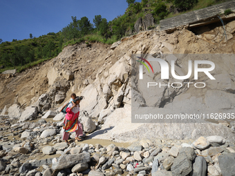 Nepali passengers travel through the BP Highway, a major highway that connects Kathmandu directly with the Southern Plains of Nepal, making...