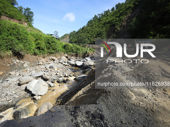 A landslide sweeps a section of BP Highway in Nepal on October 1, 2024, after heavy rainfall in the last week of September. (