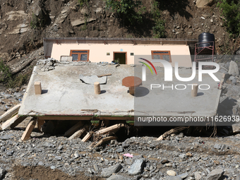 A house is damaged by flooding in Kavrepalanchowk District, Nepal, on October 1, 2024. (