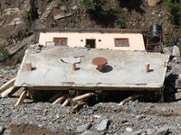 A house is damaged by flooding in Kavrepalanchowk District, Nepal, on October 1, 2024. (