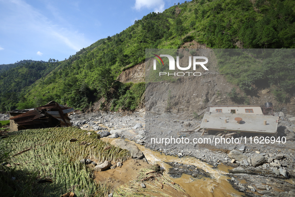 Flood damages houses and crops in Kavrepalanchowk District, Nepal, on October 1, 2024. 