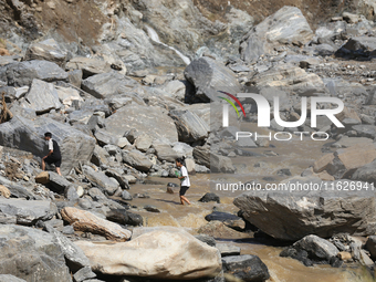 Nepali passengers travel through the BP Highway, a major highway that connects Kathmandu directly with the Southern Plains of Nepal, making...