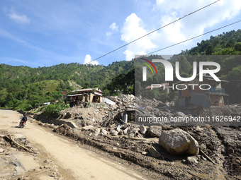 A house is damaged by flooding in Kavrepalanchowk District, Nepal, on October 1, 2024. (