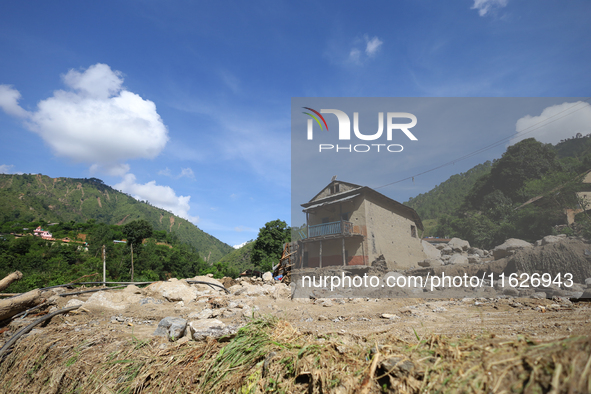 A house sustains damage from flooding in Kavrepalanchowk District along the BP Highway of Nepal, on October 1, 2024. 