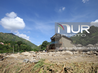 A house sustains damage from flooding in Kavrepalanchowk District along the BP Highway of Nepal, on October 1, 2024. (