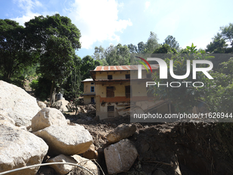 A house sustains damage from flooding in Kavrepalanchowk District along the BP Highway of Nepal, on October 1, 2024. (