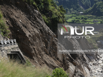 A section of BP Highway, a major highway that connects Kathmandu directly with the Southern Plains of Nepal, is damaged by a landslide in Ka...