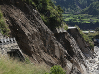 A section of BP Highway, a major highway that connects Kathmandu directly with the Southern Plains of Nepal, is damaged by a landslide in Ka...