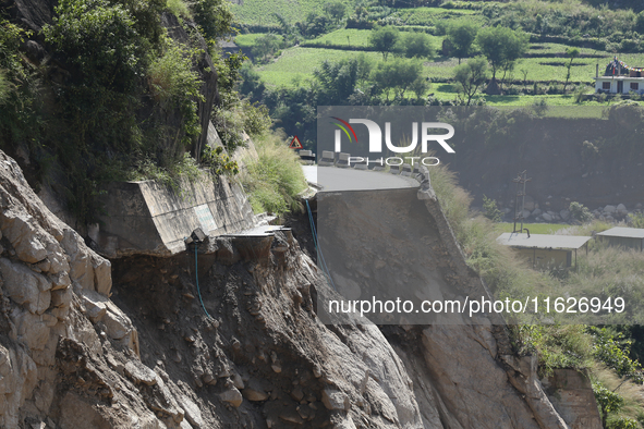 A section of BP Highway, a major highway that connects Kathmandu directly with the Southern Plains of Nepal, is damaged by a landslide in Ka...