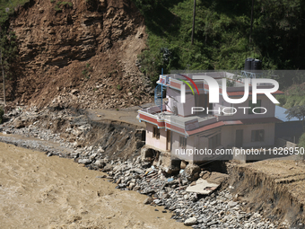 A house sustains damage from flooding in Kavrepalanchowk District along the BP Highway of Nepal, on October 1, 2024. (