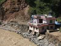 A house sustains damage from flooding in Kavrepalanchowk District along the BP Highway of Nepal, on October 1, 2024. (