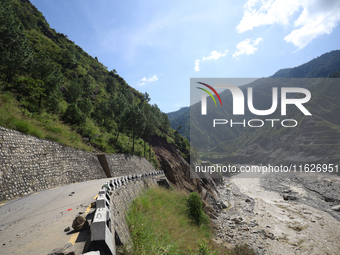 A section of BP Highway, a major highway that connects Kathmandu directly with the Southern Plains of Nepal, is damaged by a landslide in Ka...