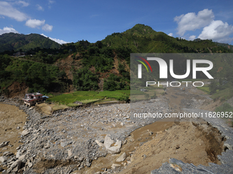 A section of BP Highway, a major highway that connects Kathmandu directly with the Southern Plains of Nepal, is damaged by a landslide in Ka...