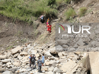 Nepali passengers travel through the BP Highway, a major highway that connects Kathmandu directly with the Southern Plains of Nepal, making...