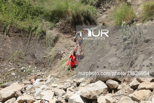 Nepali passengers travel through the BP Highway, a major highway that connects Kathmandu directly with the Southern Plains of Nepal, making...