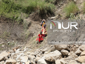 Nepali passengers travel through the BP Highway, a major highway that connects Kathmandu directly with the Southern Plains of Nepal, making...