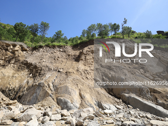 A section of BP Highway, a major highway that connects Kathmandu directly with the Southern Plains of Nepal, is damaged by a landslide in Ka...