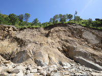 A section of BP Highway, a major highway that connects Kathmandu directly with the Southern Plains of Nepal, is damaged by a landslide in Ka...