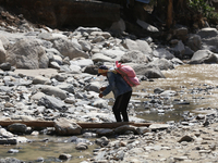 Nepali passengers travel through the BP Highway, a major highway that connects Kathmandu directly with the Southern Plains of Nepal, making...