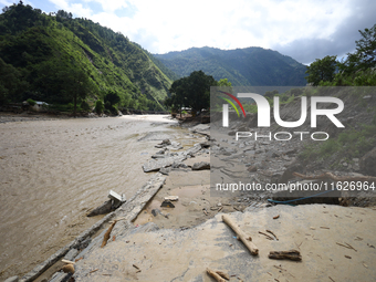 A section of BP Highway, a major highway that connects Kathmandu directly with the Southern Plains of Nepal, is damaged by a landslide in Ka...