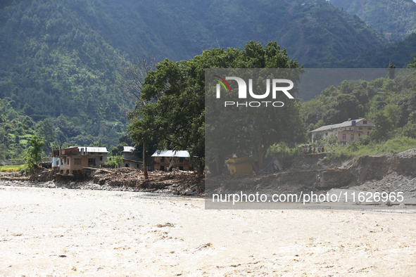 A section of BP Highway, a major highway that connects Kathmandu directly with the Southern Plains of Nepal, is damaged by a landslide in Ka...