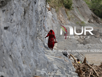 Nepali passengers travel through the BP Highway, a major highway that connects Kathmandu directly with the Southern Plains of Nepal, making...