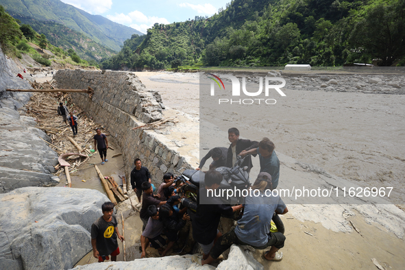 Nepali passengers traveling through the BP Highway, a major highway that connects Kathmandu directly with the Southern Plains of Nepal, carr...