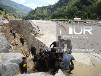 Nepali passengers traveling through the BP Highway, a major highway that connects Kathmandu directly with the Southern Plains of Nepal, carr...