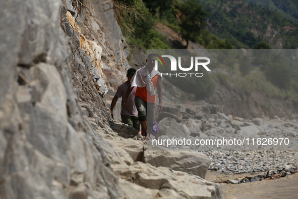 Nepali passengers travel through the BP Highway, a major highway that connects Kathmandu directly with the Southern Plains of Nepal, making...