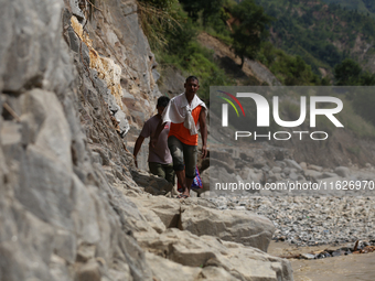 Nepali passengers travel through the BP Highway, a major highway that connects Kathmandu directly with the Southern Plains of Nepal, making...