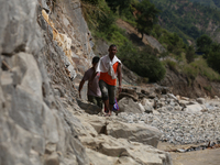 Nepali passengers travel through the BP Highway, a major highway that connects Kathmandu directly with the Southern Plains of Nepal, making...