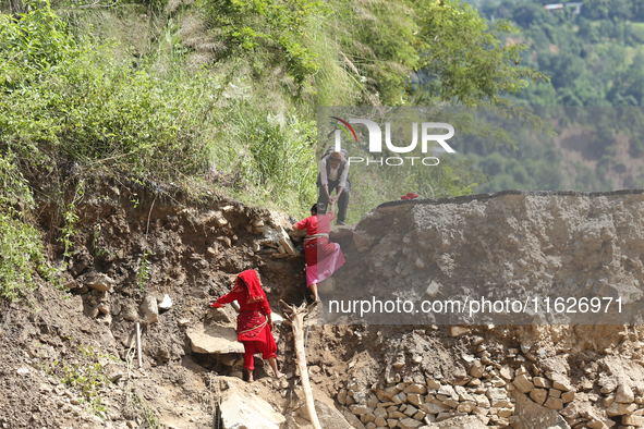 Nepali passengers travel through the BP Highway, a major highway that connects Kathmandu directly with the Southern Plains of Nepal, making...