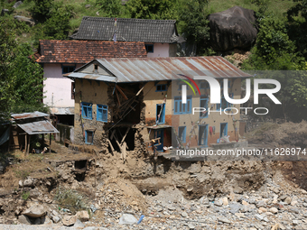 A house sustains damage from flooding in Kavrepalanchowk District along the BP Highway of Nepal, on October 1, 2024. (