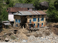 A house sustains damage from flooding in Kavrepalanchowk District along the BP Highway of Nepal, on October 1, 2024. (