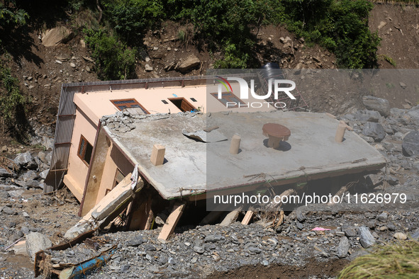 A house sustains damage from flooding in Kavrepalanchowk District along the BP Highway of Nepal, on October 1, 2024. 