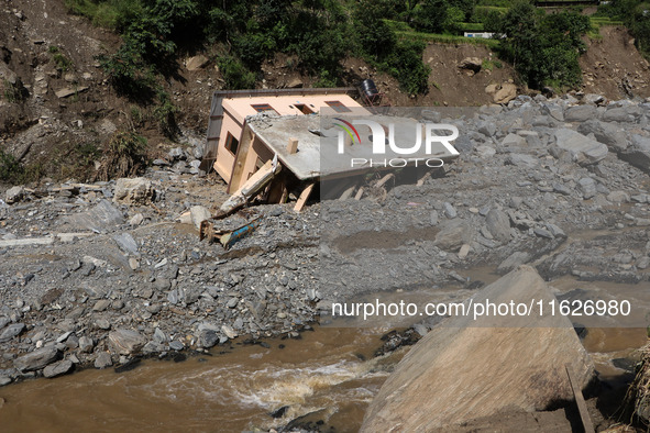 A house sustains damage from flooding in Kavrepalanchowk District along the BP Highway of Nepal, on October 1, 2024. 