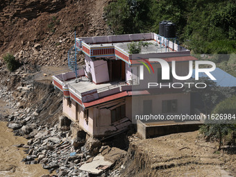 A house sustains damage from flooding in Kavrepalanchowk District along the BP Highway of Nepal, on October 1, 2024. (