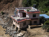 A house sustains damage from flooding in Kavrepalanchowk District along the BP Highway of Nepal, on October 1, 2024. (