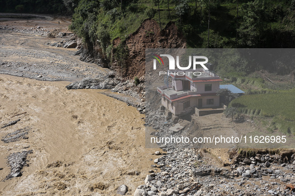 A house sustains damage from flooding in Kavrepalanchowk District along the BP Highway of Nepal, on October 1, 2024. 