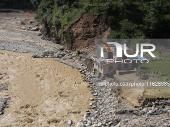 A house sustains damage from flooding in Kavrepalanchowk District along the BP Highway of Nepal, on October 1, 2024. (