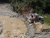 A house sustains damage from flooding in Kavrepalanchowk District along the BP Highway of Nepal, on October 1, 2024. (