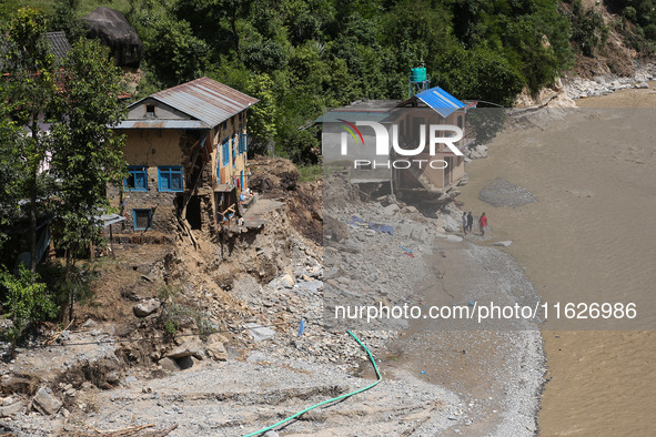 A house sustains damage from flooding in Kavrepalanchowk District along the BP Highway of Nepal, on October 1, 2024. 