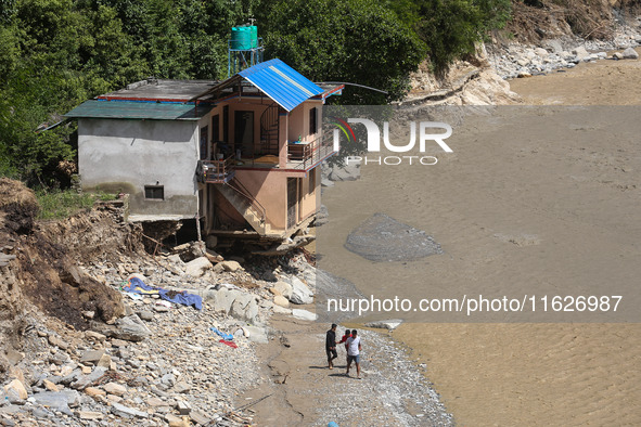 A house sustains damage from flooding in Kavrepalanchowk District along the BP Highway of Nepal, on October 1, 2024. 