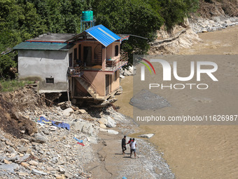 A house sustains damage from flooding in Kavrepalanchowk District along the BP Highway of Nepal, on October 1, 2024. (