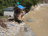 A house sustains damage from flooding in Kavrepalanchowk District along the BP Highway of Nepal, on October 1, 2024. (